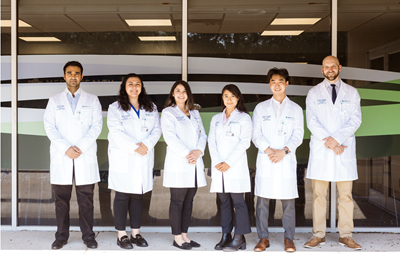 Anderson Hospital Emergency Residency team. 6 doctors in lab coats. 3 present male, 3 present female.