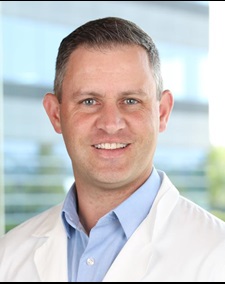 head shot of Dr. Benjamin Rose. Man in lab coat.