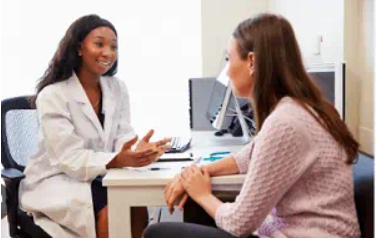 patient chatting with friendly doector