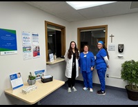 3 members of North Rd. Walk in Care staff wearing blue scrubs