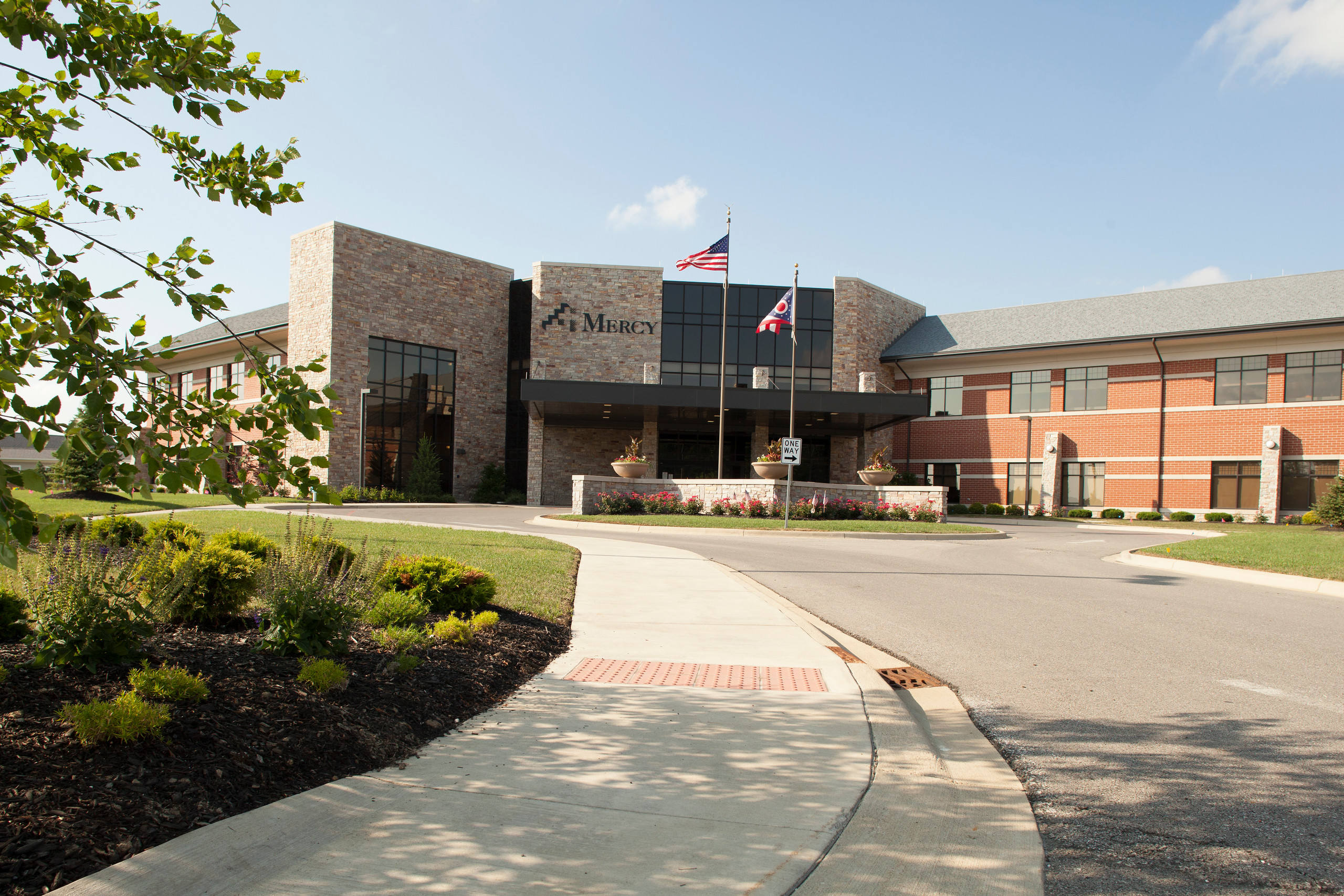 Willard Hospital exterior of driveway and main entrance with passenger  loading area.