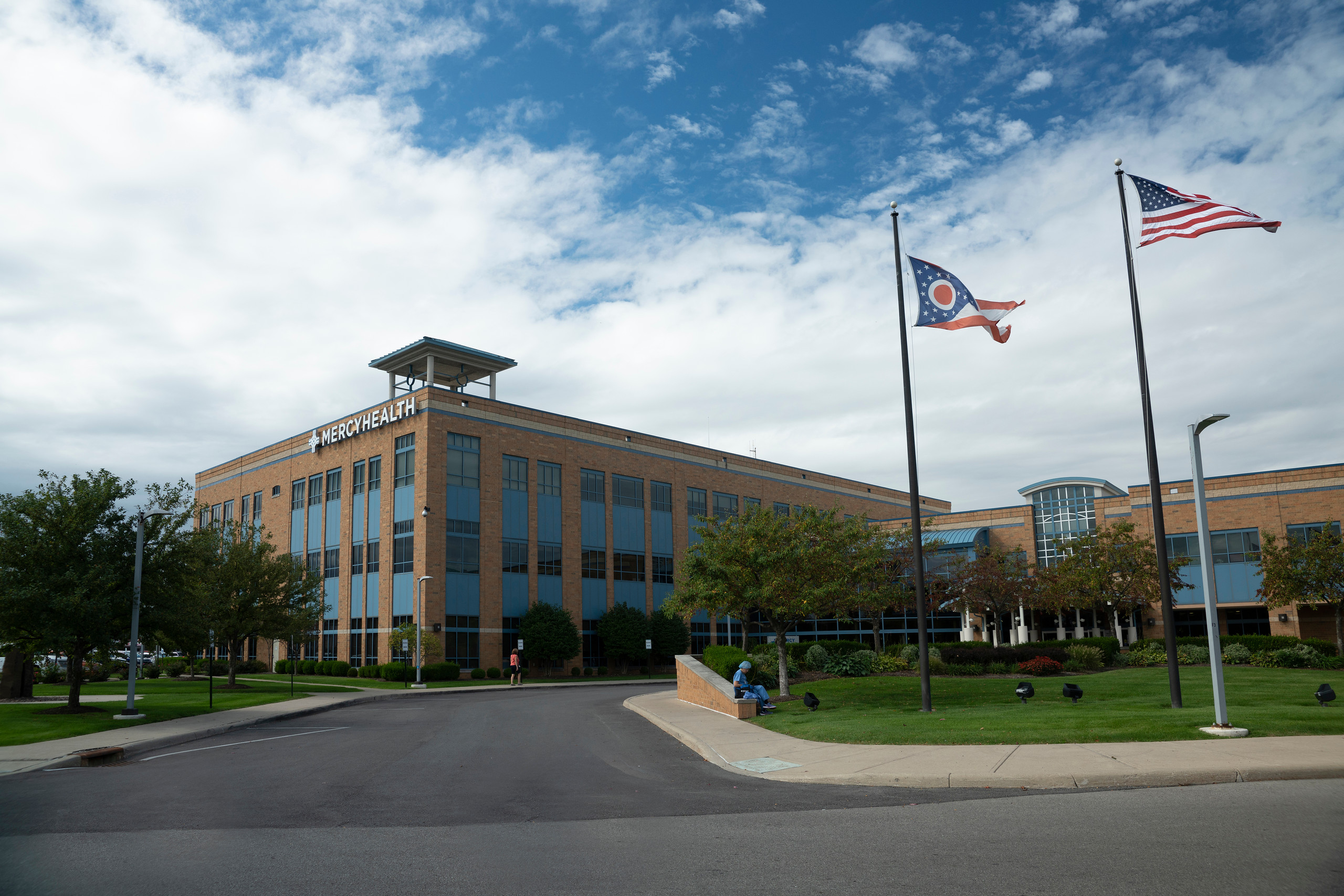 Exterior image of St. Anne Hospital with flags flying out in front.